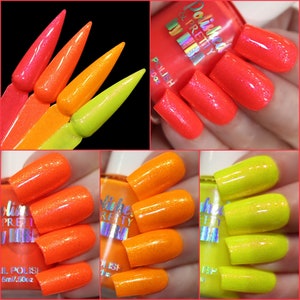 May include: Three bottles of nail polish in shades of neon pink, orange, and yellow. The bottles are labeled "Polished & Pretty by MB" and "Nail Polish 5ml/.5oz".