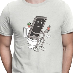 Może przedstawiać: Kreskówkowa ilustracja smartfona siedzącego na toalecie, trzymającego w ręku małą osobę. Smartfon ma smutny wyraz twarzy.