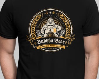 May include: A black t-shirt with a yellow and gold graphic of a Buddha holding a beer. The graphic says "Buddha Beer" and "Helping One Reach Nirvana". The graphic also says "12 fl oz" and "330 ml".