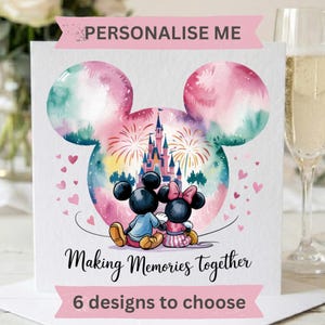 May include: A square greeting card featuring a watercolor Mickey Mouse head silhouette containing a castle and fireworks. Mickey and Minnie Mouse sit below the castle. Text reads: PERSONALISE ME, Making Memories together, 6 designs to choose.