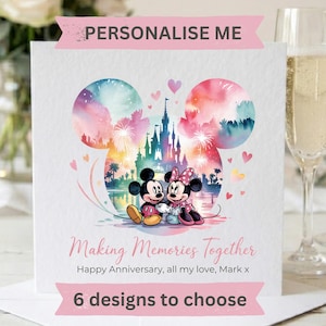 May include: A square greeting card featuring a watercolor Mickey Mouse head silhouette containing a castle and fireworks. Mickey and Minnie Mouse sit together. Text reads: PERSONALISE ME, Making Memories Together, Happy Anniversary, all my love, Mark x, 6 designs to choose.