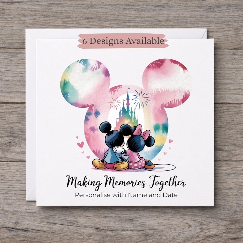 May include: A square greeting card featuring a watercolour Mickey and Minnie Mouse silhouette with a castle and fireworks inside. The text reads 6 Designs Available, Making Memories Together, and Personalise with Name and Date.