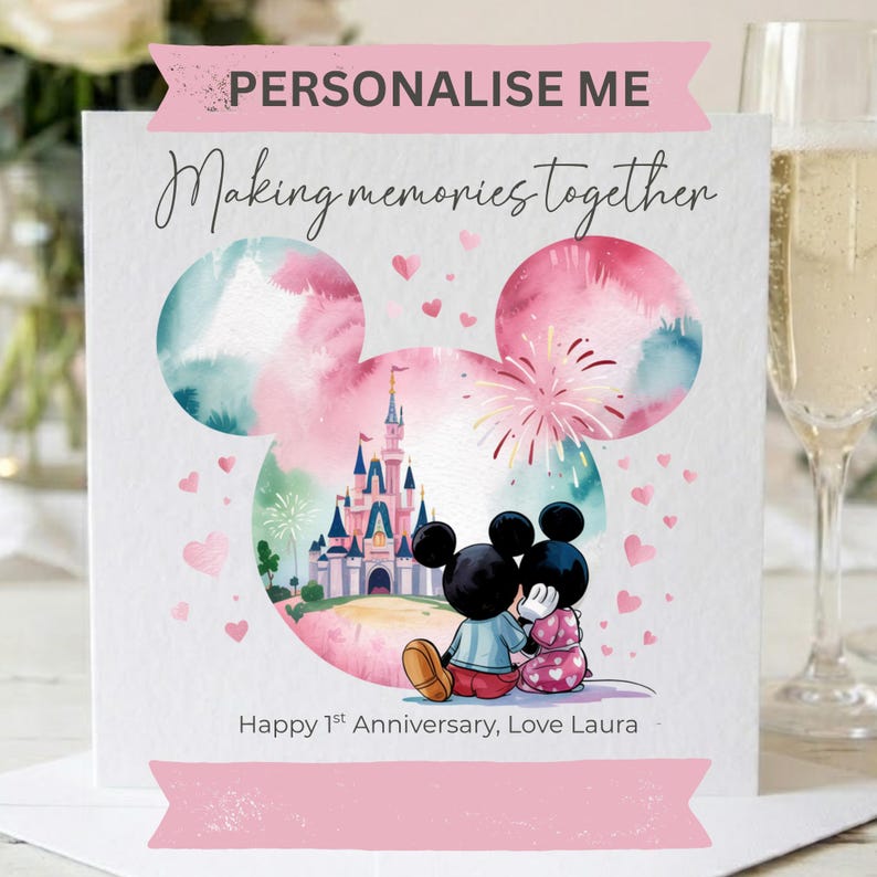 May include: A square greeting card featuring a watercolor-style Mickey Mouse head silhouette containing a castle and two cartoon mice sitting together. Text reads: PERSONALISE ME, Making memories together, and Happy 1st Anniversary, Love Laura.