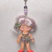 Vintage Flatsy doll. These minis have been turned into very unique, retro looking necklaces.Truly a oneofakind piece of fun kitschy jewelry.
