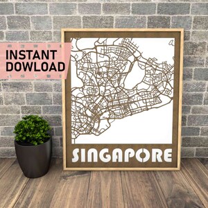 May include: A brown wood frame with a white background and a brown outline of the city of Singapore. The word "SINGAPORE" is printed in white letters at the bottom of the frame.