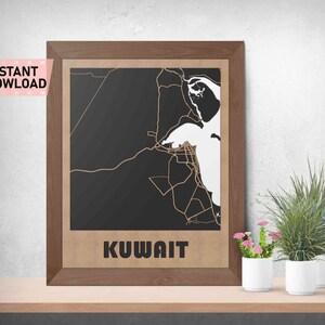 May include: A framed print of a map of Kuwait with a black background and white lines. The frame is brown wood and the print has the word "KUWAIT" at the bottom.