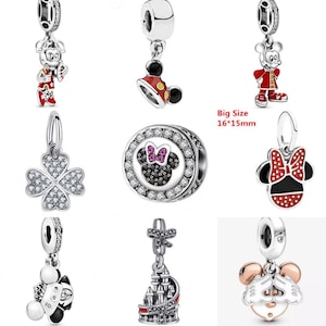 May include: Nine silver charm pendants featuring various Disney characters, including Mickey Mouse, Minnie Mouse, and a four-leaf clover. The charms are approximately 1.6 inches by 1.5 inches in size.