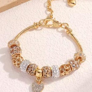 European Style Snake Charm Bracelet. Gold 7&quot;+ 2.3&quot; Extender. (includes charms as pictured). (B11)
