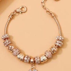 European Style Snake Charm Bracelet. Gold 7&quot;+ 2.3&quot; Extender. (includes charms as pictured). (B12)