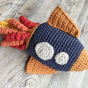 Rocket ship rattle, Crochet space toy, Space themed rattle