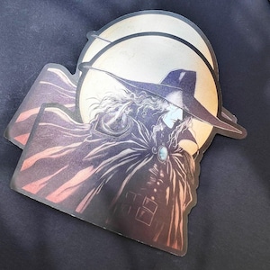 May include: A black and white illustration of a vampire with a long cape and a wide-brimmed hat. The vampire is standing in front of a large, yellow moon.