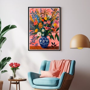 May include: A colorful floral arrangement in a blue and white porcelain vase with a floral pattern. The flowers are arranged in a vase on a wooden table. The background is a pink and white floral pattern.