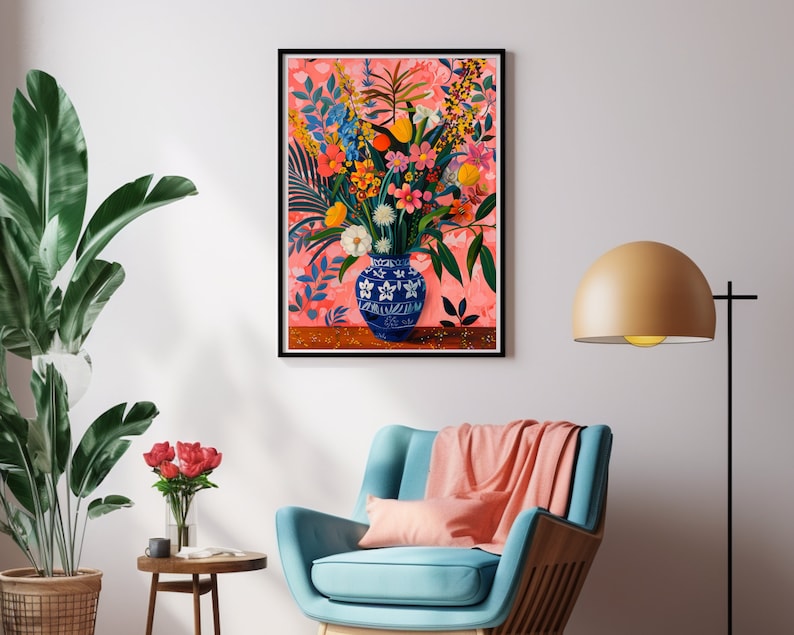 May include: A colorful floral arrangement in a blue and white porcelain vase with a floral pattern. The flowers are arranged in a vase on a wooden table. The background is a pink and white floral pattern.