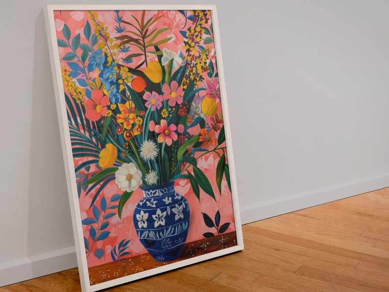 May include: A framed painting of a colorful floral arrangement in a blue and white patterned vase. The flowers are arranged in a vase with a pink background.
