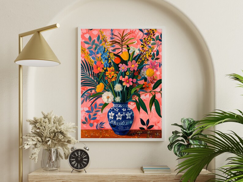 May include: A painting of a blue and white vase filled with a colorful bouquet of flowers. The flowers are arranged in a vase with a floral pattern. The background is a pink and white floral pattern.