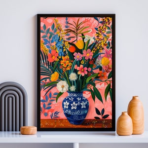 May include: A painting of a blue and white vase filled with a colorful bouquet of flowers. The flowers are pink, yellow, orange, red, and white. The vase is on a table with a pink background.