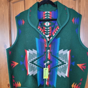 May include: Reversible green and multi-colored patterned vest with a button closure and a tag that says "Reversible" and "Size Large".