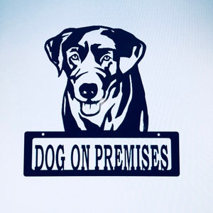 May include: Black metal silhouette of a dog's head with a sign that reads "DOG ON PREMISES".