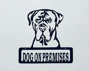 May include: Black metal sign with a silhouette of a dog's head and the text "DOG ON PREMISES".
