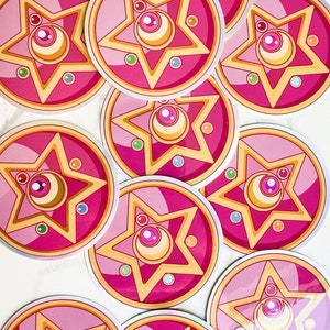 Elevate your style with a touch of whimsical flair! Our Crystal Star Brooch sticker captures the essence of Sailor Moons enchanting universe. Whether a gift or a treat for yourself, this accessory is sure to delight.