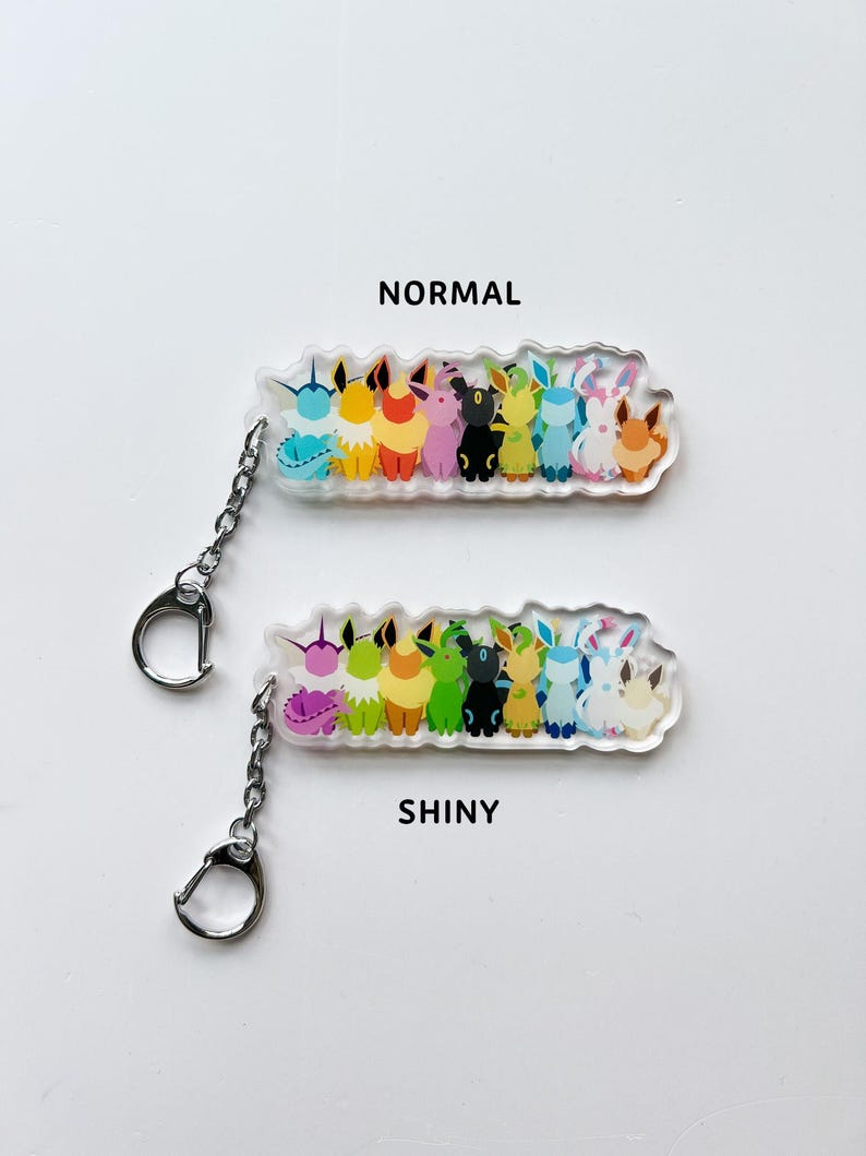 Eeveelution acrylic keychains, both normal and shiny Eevee options available. Featuring all the Eeveelutions: Flareon, Jolteon, Vaporeon, Umbreon, Espeon, Leafeon, Glaceon, and Sylveon with a metal clip on attachment.