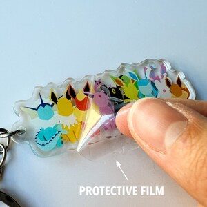 Clear protective film on the Eeveelution keychain to protect the artwork on this clear acrylic keychain.
