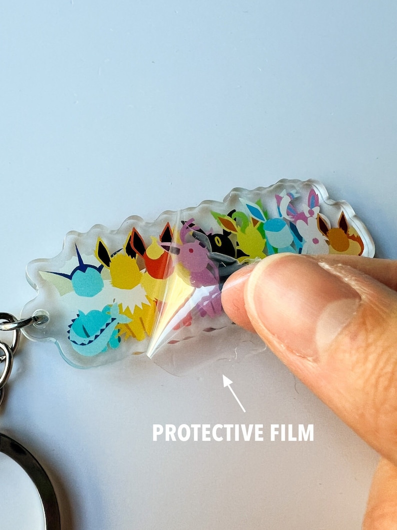 Clear protective film on the Eeveelution keychain to protect the artwork on this clear acrylic keychain.