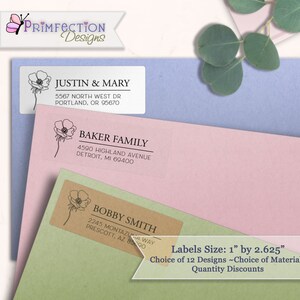May include: Three personalized address labels with a floral design. The labels are 1 inch by 2.625 inches and are available in 12 designs. The text on the labels reads "Justin & Mary", "Baker Family", and "Bobby Smith".