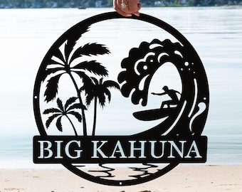 May include: Black metal sign with a surfer riding a wave, palm trees, and the text "BIG KAHUNA".
