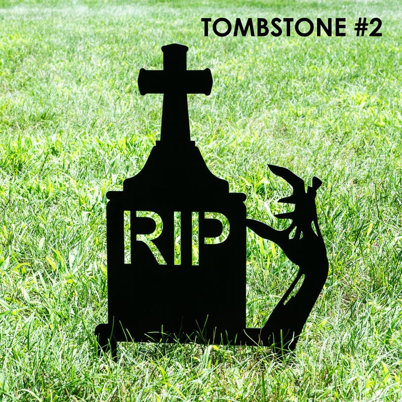 May include: Black tombstone silhouette with a cross on top and the letters "RIP" in white. A zombie hand emerges from the ground. The text "TOMBSTONE #2" is at the top. Perfect for Halloween decorations.