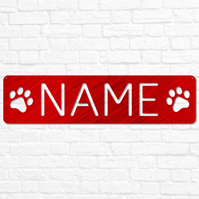 May include: Red metal sign with white paw prints on either side and the word "NAME" in white lettering.