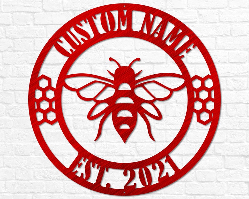 May include: Red metal circle with the text "CUSTOM NAME EST. 2021" around the edge. A stylized bee with honeycomb designs is in the center.