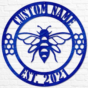May include: Blue metal bee and honeycomb design with the text "CUSTOM NAME EST. 2021" in a circle.