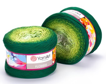 May include: Two skeins of YarnArt Flowers yarn. The yarn is a gradient of green and yellow, with a dark green exterior. The label reads "Flowers" and features a colorful floral design. Ideal for knitting and crochet projects.