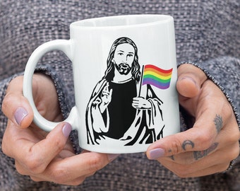 Gay Pride Jesus Holding LBGTQIA+ Rainbow Flag Coffee Mug 11 or 15 oz
