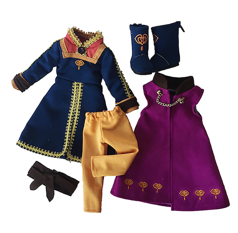 May include: A doll outfit set with a blue and gold jacket, yellow pants, a purple cape, and blue boots. The outfit features a gold chain and embroidered details.