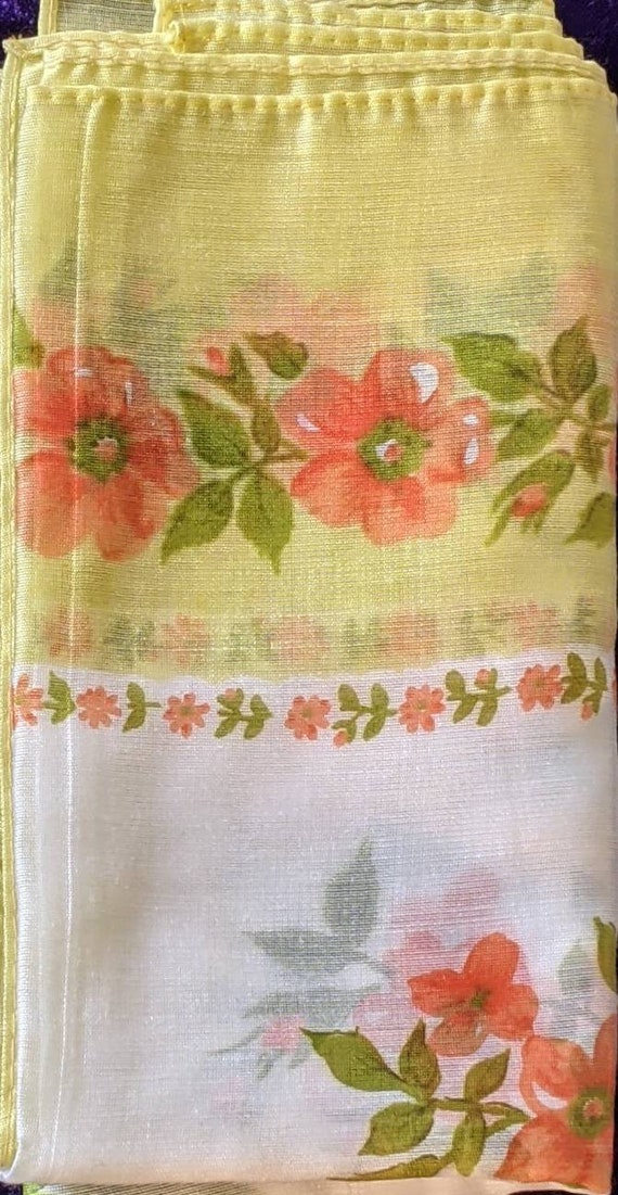 Scarf with orange flowers and lime green borders.