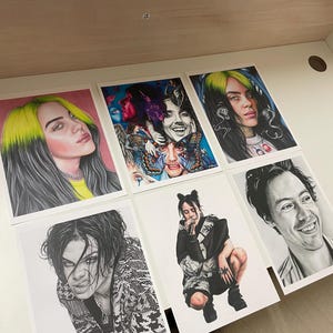 May include: A set of six prints featuring different portraits of a young woman with bright green hair. The prints are all in black and white except for one, which is in color and features a butterfly.