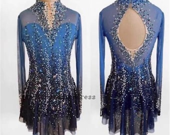 May include: A blue and black figure skating dress with long sleeves. The dress is embellished with sparkling rhinestones and features a high neckline and a keyhole back design. The skirt is a layered, flowing style.