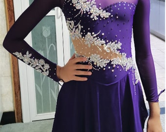 May include: Purple figure skating dress with long sleeves and a sheer overlay. The dress is decorated with silver floral embellishments and rhinestones. The dress has a scoop neckline and a fitted bodice. The skirt is a-line and has a slight flare. The dress is made of a stretchy, comfortable fabric. The text "etsy: customicedress" is visible at the bottom of the image.
