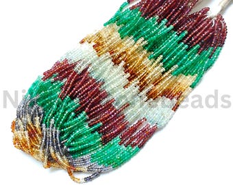 May include: A collection of colorful gemstone beads in shades of green, red, white, and yellow. The beads are strung together, forming a textured pattern. The image has the text "N Beads".