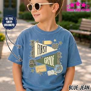 May include: A blue t-shirt featuring a graphic design with two pennants labelled FIRST GRADE, a backpack, a pencil, an apple, a globe, an open book, and a rectangular sign with the name Maverick. The text ALL TEXT CAN BE CUSTOMIZED is visible.