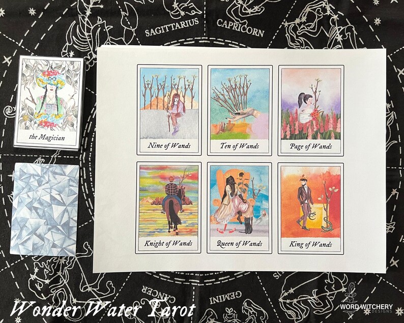 May include: A set of nine tarot cards featuring watercolor illustrations of the Major Arcana and the suit of Wands. The cards are printed on white cardstock and have a white border.