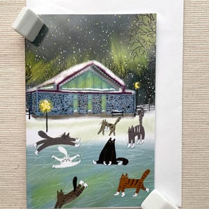 Carte de voeux pour les fêtes avec des chats en patinage sur glace (4 x 6 po.) avec enveloppe - Scène d'hiver fantaisiste, vierge à l'intérieur pour des messages personnalisés