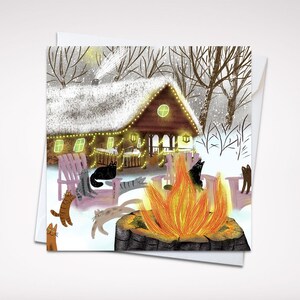 Tarjeta navideña con un gato en una acogedora cabaña de invierno (5" x 5") con sobre: encantadores gatos alrededor del fuego, interior en blanco para su mensaje festivo