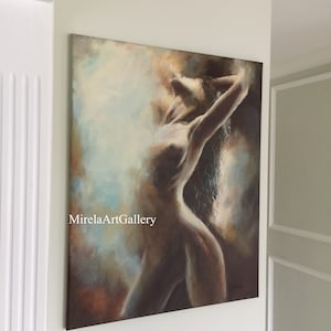 May include: A painting of a nude woman with long hair, painted in shades of brown, blue, and white. The woman is posed with her arms raised above her head, and her body is illuminated by a soft light. The painting is signed in the lower right corner.
