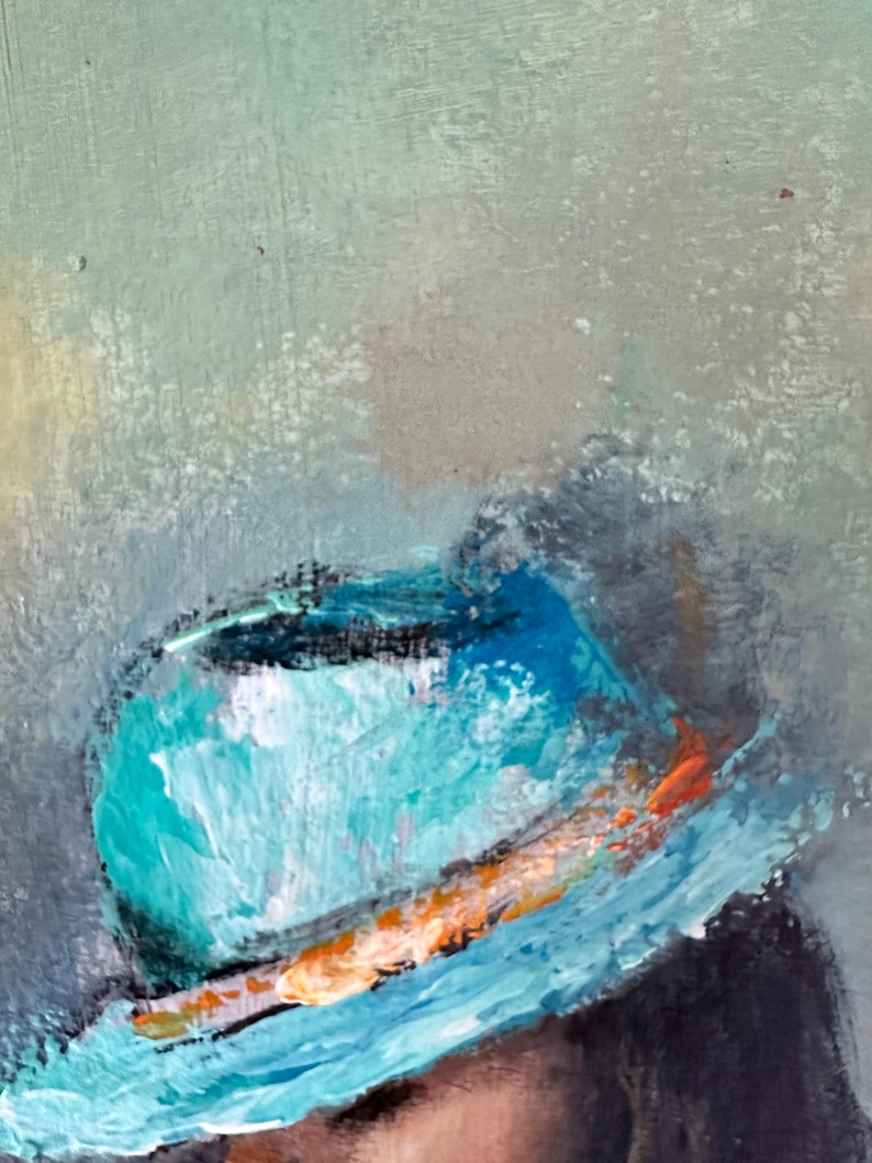 May include: A close-up of a teal blue hat with a light orange and white band. The hat is painted in a textured style.