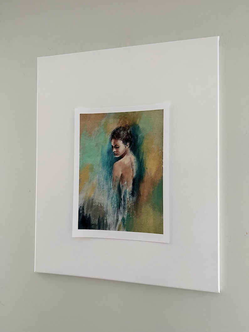 May include: A framed painting of a woman with dark hair and a blue and green background.