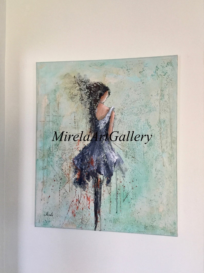 May include: Abstract painting of a woman in a blue dress with her hair blowing in the wind. The background is a textured green and blue with splashes of red and orange. The painting is signed "Sorela" in the bottom left corner and "Mirela Art Gallery" in the bottom right corner.