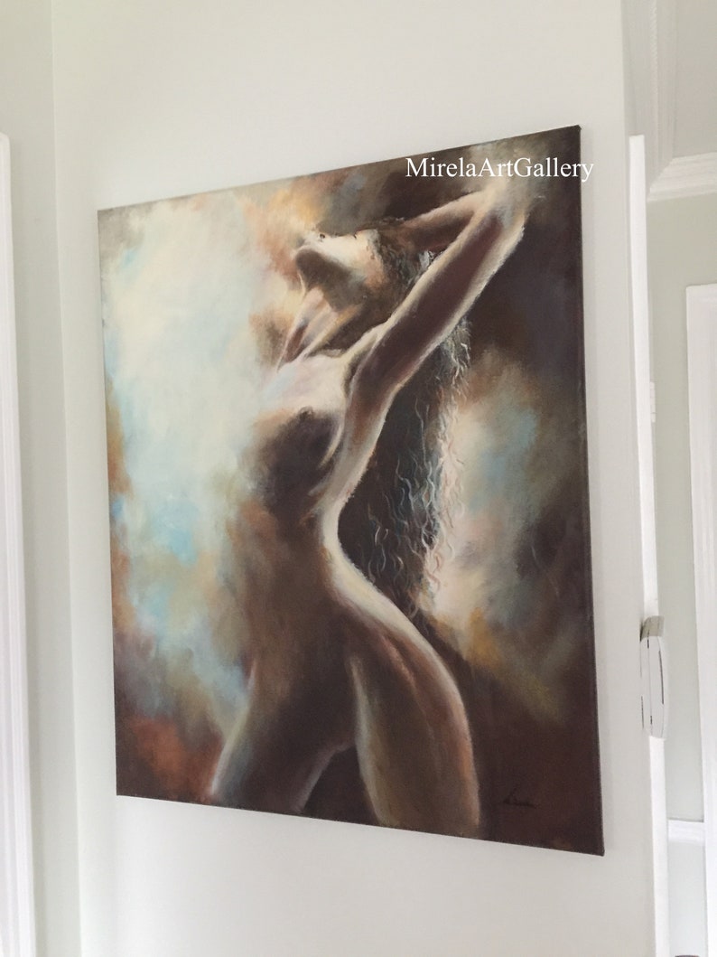 May include: A painting of a nude figure with long, flowing hair, rendered in shades of brown, beige, and blue. The figure is posed with arms raised above their head, creating a sense of movement and energy. The background is a soft, abstract wash of color.